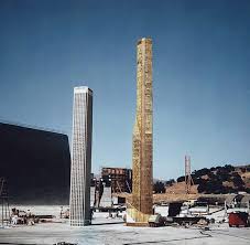 Filming in miniature behind the scenes on The Towering Inferno (1974).