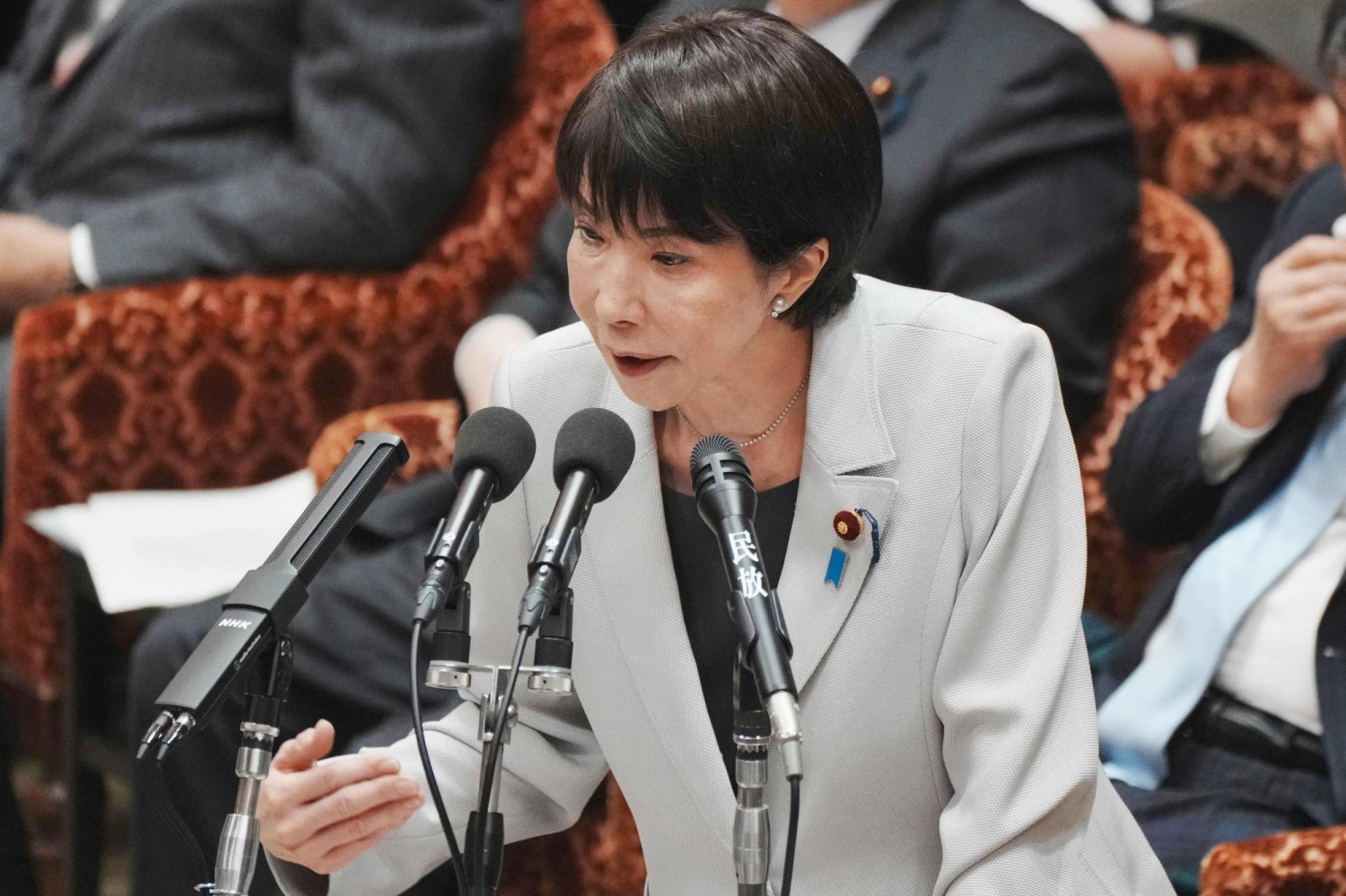 出典: The Japan Times, 報道写真 高市早苗首相が国会で台湾侵攻に関する発言をしている様子